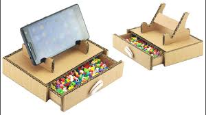 You can build this by watching this video. How To Make Mobile Stand With Secret Storage Drawer Using Cardboard Youtube