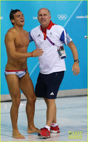 Great britain's tom daley (right) and matty lee during the men's synchronised 10m platform final at the tokyo aquatics centre on the third day of the tokyo 2020 olympic games. Tom Daley And His Diving Coach Celebrate After Daley Wins Bronze Man Standing Pose Tom Daley Standing Poses