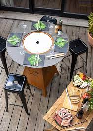 a concept to discover restaurant high table with integrated gas bbq plancha magma gas model by vulx madeinf outdoor bar table restaurant tables wood fuel
