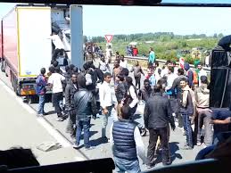 Image result for migrants in calais boarding trucks