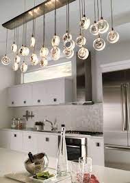 Choosing a light that is reflective of the design style of each space can create a sense of uniformity. Canadalightingexperts Bling Twenty Six Light Chandelier Modern Kitchen Lighting Kitchen Lighting Design Kitchen Island Lighting