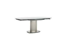 Glass extending table that can be used as a coffee table or as a dining table for up to 16 people once raised and extended. Flow Swivel Glass Dining Table With 4 Chairs Furniture Village