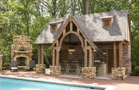 The houses tend to be grander designs that include other luxurious features but can also be simpler homes with less square footage. 20 Gorgeous Poolside Outdoor Kitchen Designs Rustic Outdoor Kitchens Pool Houses Pool House Designs