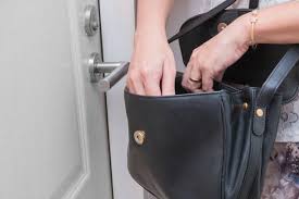 woman searching in her purse.