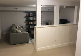 A custom bar aligns with the stair treads and is the same wood and finish as the floors upstairs. Before And After Basement Loft Like Lower Level This Old House