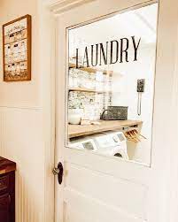 What are the basics?—white, wood textures, charming details, creative storage, and durable #ceramictile! Farmhouse Laundry Room Laundry Room Doors Vintage Laundry Room Farmhouse Laundry Room