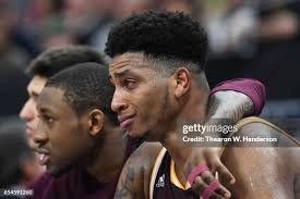 E.C. Matthews of the University of Rhode Island shoots while Khyri... News  Photo