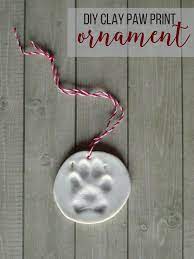 Create An Easy Keepsake Ornament To Remember Your Puppy S First Christmas With This Diy Clay Paw Print Paw Print Ornament Paw Print Crafts Dog Paw Print Craft
