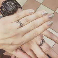 Matching wedding ring tattoos on fingers are extremely popular among couples. 40 Sweet Meaningful Wedding Ring Tattoos Ring Tattoo Designs Tattoo Wedding Rings Wedding Band Tattoo
