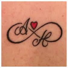 Infinity Symbol Tattoo With My Twins Initials Symbolic Tattoos Infinity Symbol Tattoo Tattoos For Daughters
