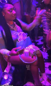 Megan Thee Stallion bandages her foot as she celebrates the success of WAP  at the strip club | Daily Mail Online