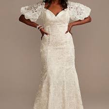 It's traditional, but has a low cut and a tie at the back of the neck give it a bit of extra personality. 30 Best Puff Sleeve Wedding Dresses Of 2021
