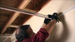 Install ceiling tile and pull the tile up to the cross tee making sure that it is square with the tee. Installing Your Usg Ceiling Grid And Tile Youtube