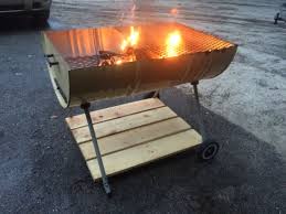 The barrel pit this fire pit is made from an old barrel and old horseshoes. 55 Gal Drum Grill Fire Pit Plus Some Wood And A Cheap Charcoal Grill Legs Barrel Fire Pit Fire Pit Designs Fire Pit Backyard