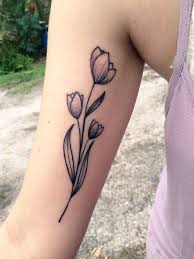 Green for the leaves, red and pink for the flowers, and a little bit of black for the highlights. Tulip Tattoo Ideas That Will Make Your Body Even More Attractive