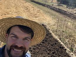 How to care for first time potatoes and garlic bed?