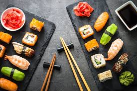 Sushi And Sushi Roll Set On Black Stone Table Top View Sushi Rolls Food Flatlay Food