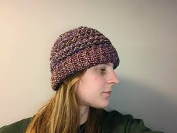 I wore my beanie yesterday and found out it's way too big for me. So I  tapered it by frogging 4 rows ( ended with 12 puff rows) and added a pompom