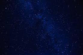 A dark blue sky filled with stars with a castle like structure on a hilltop that is illuminated with lights. Stars In The Night Dark Blue Sky With The Milky Way Stock Photo Picture And Royalty Free Image Image 58036977