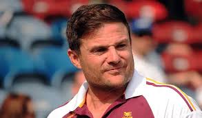 Simon Woolford says Huddersfield must not dwell