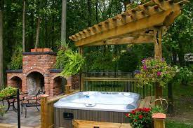 When it comes to the idea of diy hot tubs , it is not just functionality that wins, but you also get to save a truck load of cash and resources. Hot Tubs In Landscaped Gardens Inspiration Outdoor Living Jacuzzi Direct