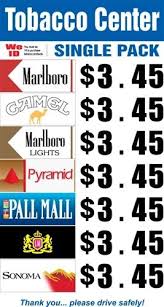 A carton of marlboro reds costs about 18 dollars. Cigarette Price Signs