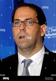 Tunisia's new Prime Minister Youssef Chahed delivers a speech in Tunis,  Wednesday, Aug.3, 2016. Chahed served as minister for local affairs in the  government that fell over the weekend in a no-confidence