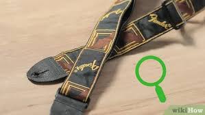 How to attach a strap to a guitar. 3 Ways To Put A Strap On A Guitar Wikihow