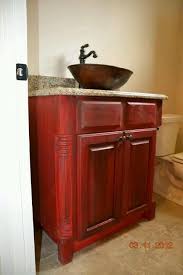 The wooden vanity countertop runs straight on as bathtub panelling and continues all the way up the wall behind the wet areas, doubling as a backsplash and decor. Bathroom Vanity In Red Distressed Glamorous Bathroom Decor Vintage Bathroom Tile Diy Bathroom Design