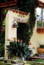 In the center there is a water fountain. Super Exterior Entrance Stairs Potted Plants Ideas Spanish Style Homes Hacienda Style Spanish Style
