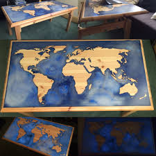 The spacious glass tabletop gives you plenty of room to work on your latest novel or plan out your next adventure, and it displays a beautiful map design for an inspired aesthetic. Glow In The Dark Epoxy And Pine World Map Coffee Table Wood Table Design Wood Resin Table Epoxy Resin Table