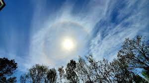Halo (from greek ἅλως, halōs) is the name for a family of optical phenomena produced by light (typically from the sun or moon) interacting with ice crystals suspended in the atmosphere. What Causes A Halo Around The Sun