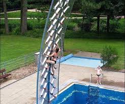 Rock Wall Installed Over Swimming Pool Crazy Pool Cool Pools Backyard Accessories
