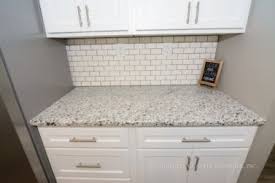 We will do all for you. White Granite With Black Specks Paired With White Cabinets In A Union Missouri Residence White Cabinets Granite Countertops White Cabinets White Countertops