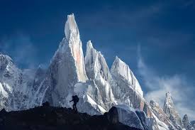 Picture Of A Hiker Trekking Past Tall Thin Snowy Mountains In Patagonia National Geographic Photo Contest National Geographic Photos Shot Photo