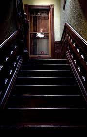 The style of narration is similar to that. A Tourists Casts An Erie Reflection In A Window As He Passes On An Upper Level Of The Winchester Mys Winchester Mystery House Winchester Homes Winchester House
