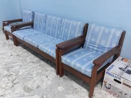 A coffee table, featuring unique slatted design, is also included. Wooden Sofa Set With Cushion Foam Furniture Home Living Furniture Sofas On Carousell