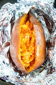 Learn How To Bake Sweet Potatoes By Wrapping Them In Aluminum Foil And Then Cooking Them In Th Cooking Sweet Potatoes Sweet Potato Oven Baked Sweet Potato Oven
