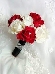 Clematis buds and vines tumble out between them, and generous lengths of peach silk ribbon accented with tiny gold tassels reinforce the. Pin By Julia On Baby Bear Baby Shower In 2020 Red Bouquet Wedding Red And White Roses Red Wedding Flowers