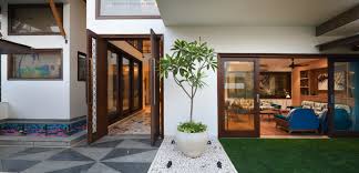 Modern villa with colored led lights at night. In This Delhi Home From Flooring To Furniture Everything Is Made In India Architectural Digest India
