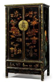 32h empire style oriental cabinet in black lacquer with gold leaf handpainted in chinese bird and flower. A Chinese Black Gold And Polychrome Lacquer Cabinet