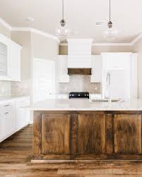 She would like this to look pretty close to a white paint but still have some of the. Modern White Rustic Kitchen With Dark Stained Island And Custom Shiplap Hood In 2021 Stained Kitchen Cabinets White Kitchen Rustic Shiplap Kitchen