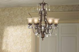 Cliff went ahead and put up the ceiling medallions in the entry and the dining room. A Dining Room Chandelier Accented With An Open Work Ceiling Medallion Lamps Plus