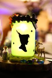 My Peter Pan Centerpiece For My Wedding Created With The Cricut Captured By North Islan Peter Pan Wedding Halloween Wedding Centerpieces Disney Centerpieces