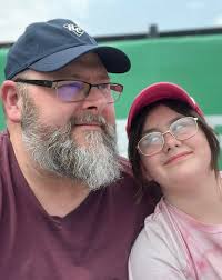 Spartanburgers fan grilling with apron