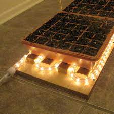 Grow light and heat mat. Diy Heat Mat Speeds Seed Starting Finegardening