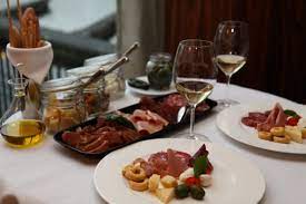 Any of various typically italian hors d'oeuvres also : Antipasto Wikipedia