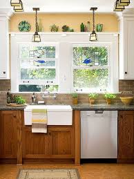 This way the oak cabinetry can gain a beautiful golden glow. 8 Ways To Decorate With Oak Cabinets For A Modern Look Kitchen Sink Decor Update Oak Cabinets Kitchen Remodel