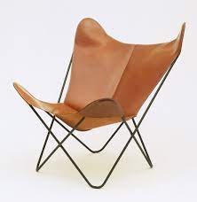Tripolina was a foldable chair made of wood and italian leather. Iconic Modern Design The Butterfly Chair