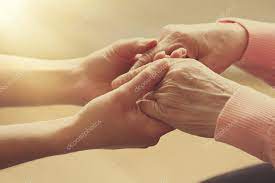Old and young holding hands on light background, closeup Stock Photo by ©belchonock 64267329